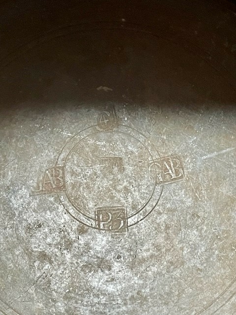 Jug and cover, all in pewter, with conical body  and a loop handle. On the cover knob in the form of a pine cone. On the body sections of horizontal borders. Five hallmarks inside the jug.