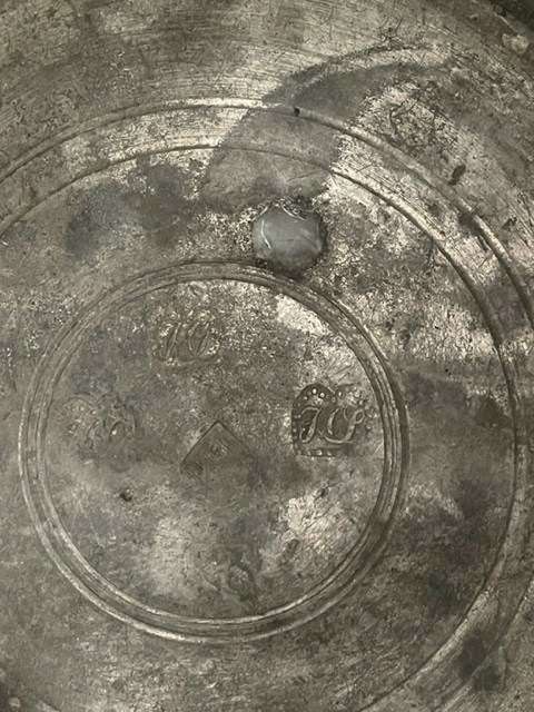 Jug and cover, all in pewter, with conical body  and a loop handle. On the cover knob in the form of a pine cone. On the body sections of horizontal borders. Five hallmarks inside the jug.
