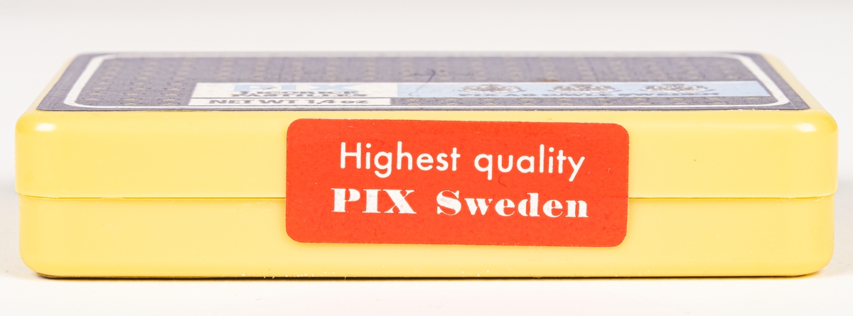 Tablettask av plast med innehåll och försegling intakt. Blå etiketter med guldstjärnor, lakrispastiller "PIX licorice pastilles".