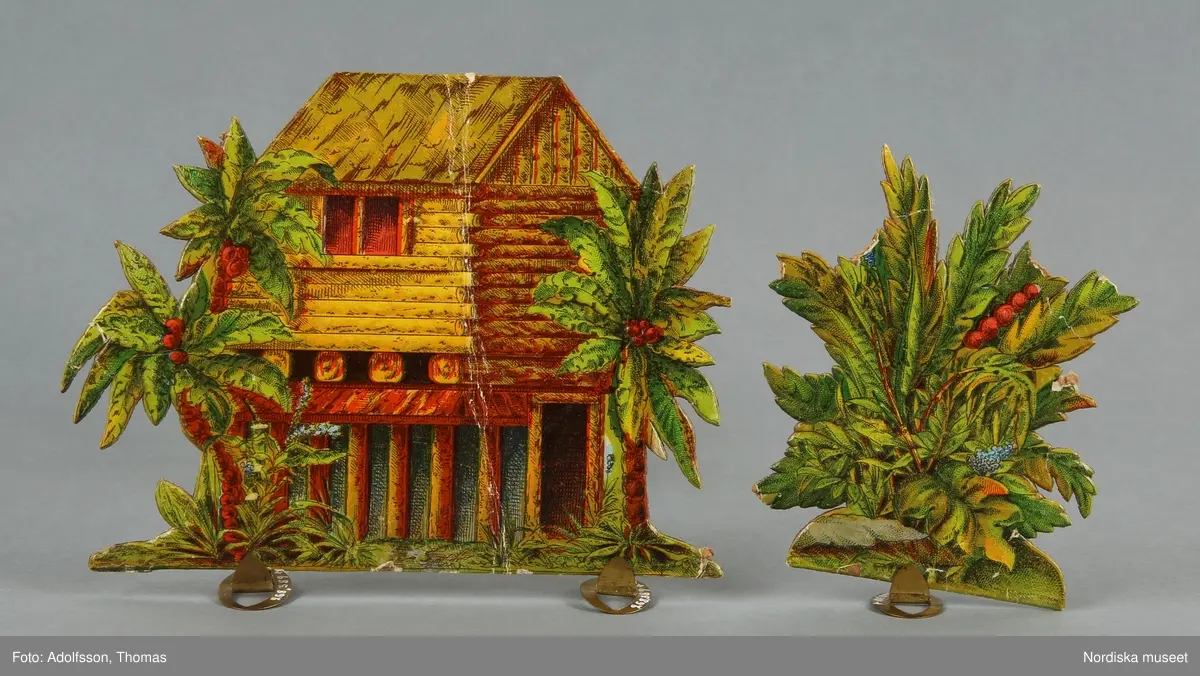 Pappersleksak i flera delar (18 lösa bitar enligt katalogkort) föreställande kamp mellan indianer och cowboys i vilda västern.