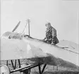 Flygförare K. G. Hultström sitter i ett flygplan Thulin B vid Thulins flygskola i Ljungbyhed, omkring 1916-1918.