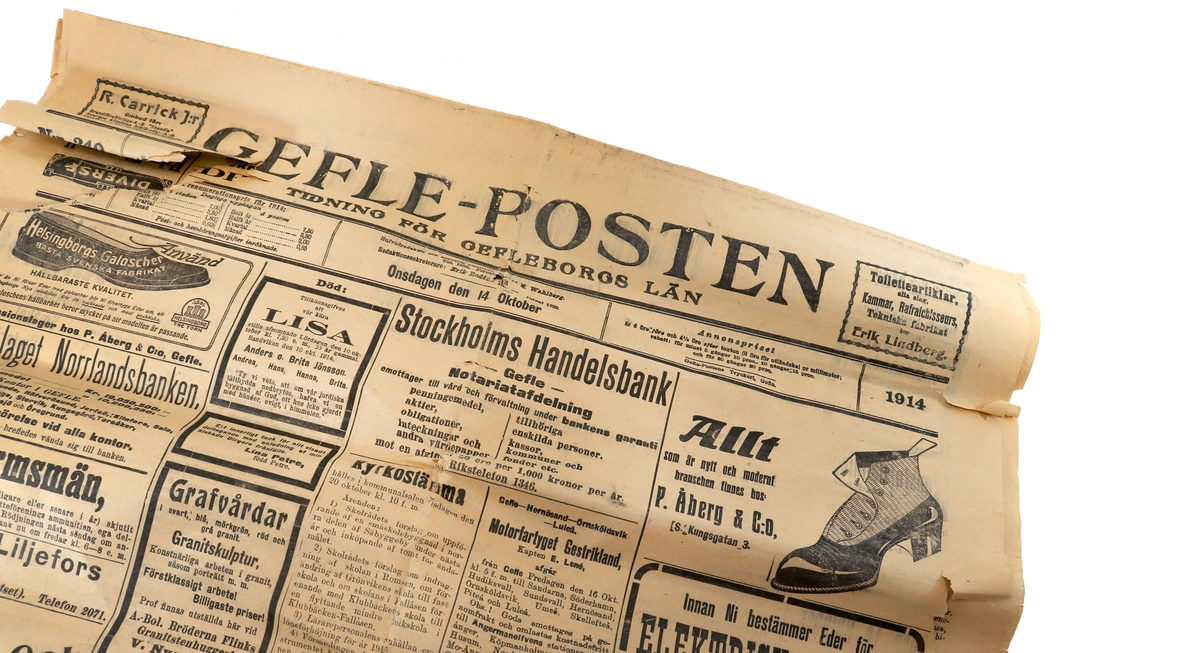 "En hälsning till upphittaren" - låda innehållande Gefle-posten, enkronasedel och ett brev från Fränkel & Bellander, 1914.