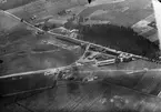 Flygfotografi av Flygkompaniets tygverkstäder på Malmen, omkring 1922.