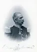 Porträtt av överste Wilhelm Reuterswärd. Född 1837 på Rotenbergs säteri i Östra Stenby socken som son till Anders Wilhelm Reuterswärd och Augusta Fredrika Elisabet Valt von Steijern. Från 1869 gift med Carolina Adelaide Brändström, efter hennes död 1875 omgift med Johanna Beata Karolina af Robson. Han inledde sin militära karriär som furir vid Närkes regemente 1854. Avancerade i rang genom åren till att år 1890 bli överste och chef för Västgötadals regemente och Första livgrenadjärregementet i Linköping samma år.