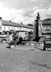 Stora torget med fontänen och en kiosk.