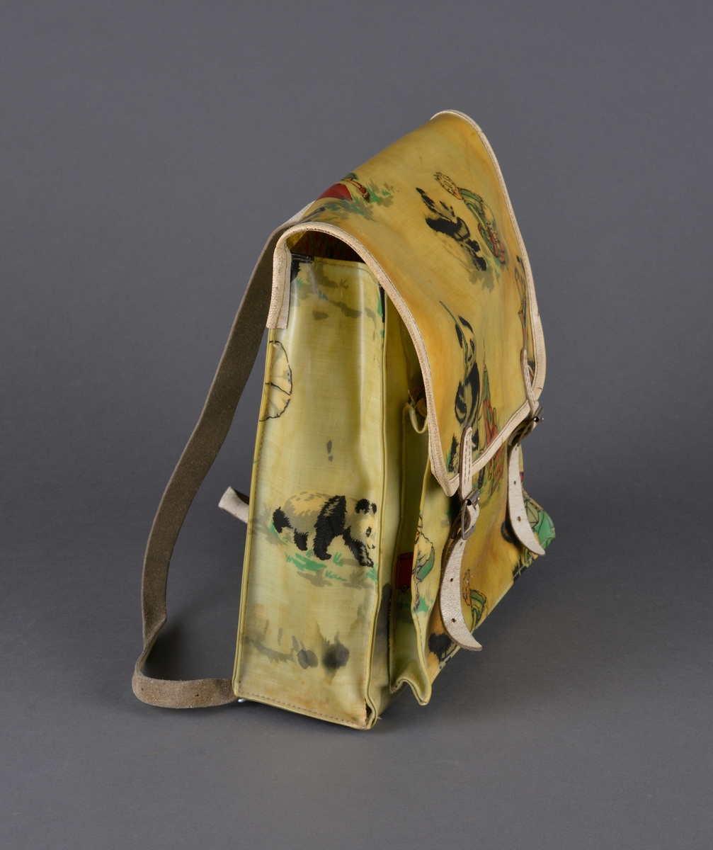 Skoleransel for mindre barn
Kvaderatisk med stropper for å henge på ryggen. Kan lukkes med et lokk med reimer med lås. 
Dekor: barn og dyr