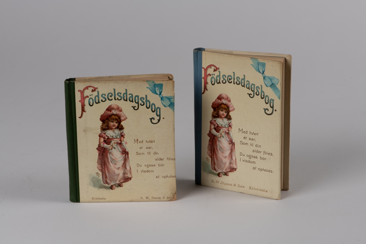 Fødselsdagbog, 2 stk. N. W.Damm & Søn, Kria. ca. 1904. 
a)  dedikasjon "  Til moder fra Gunnar. Julaften 04 12 011. 11
 Rygg grønn shirting. 10,7 x 9 cm. 
b)rygg blå shirting. 12,2 x 8,5 cm. 
Bøkene er en tanke forskjellige og representerer to forskjellige utgaver. 
a) litt slitt, b) god Tilstand.  

a) Tilhørt fru Sophie Krøger, f. Olsen 
b) frk. Ingrid Krøger eller søsteren Margr. Frederikke Strøm, f. Krøger.