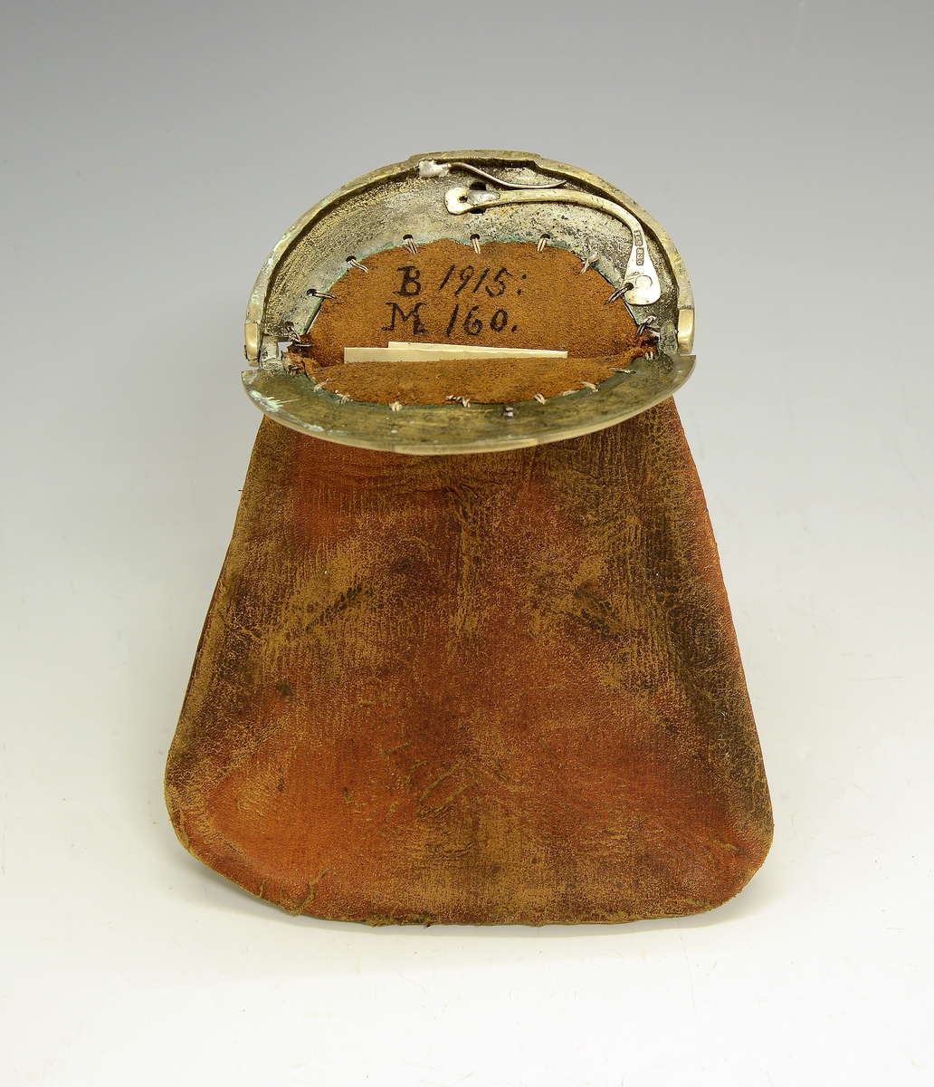 Pengepung. Fra protokollen: Pengepung med gravert messinglaas.