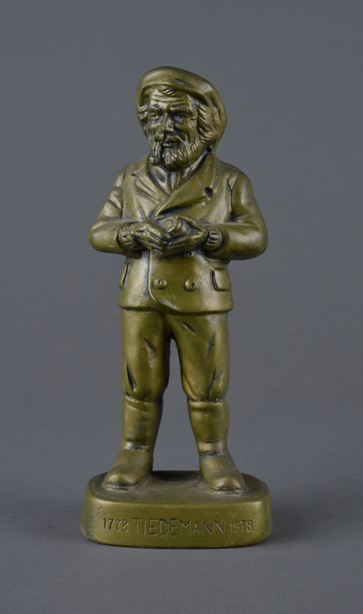 Mann med snadde og tobakkseske.
Reklame for Tiedemanns tobak