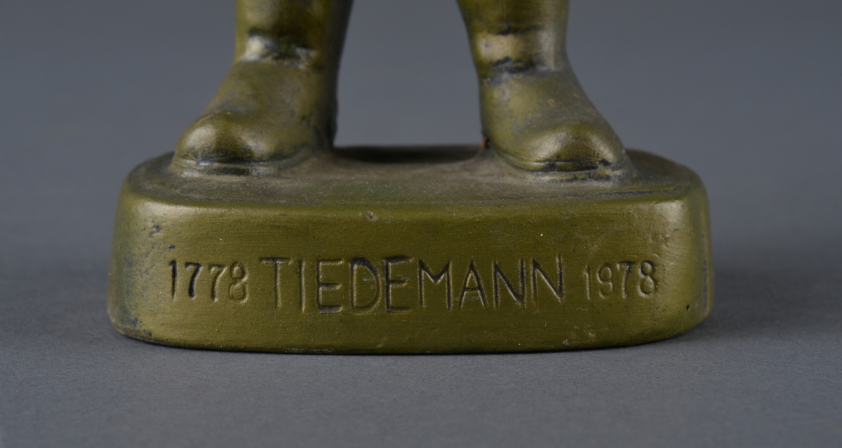 Mann med snadde og tobakkseske.
Reklame for Tiedemanns tobak