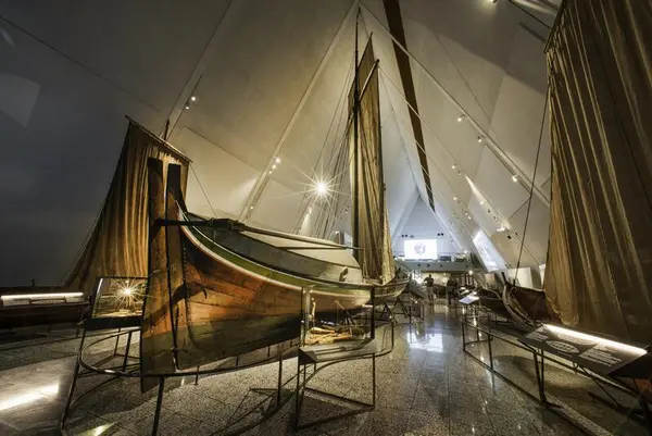 Traditional 19th-century Norwegian sailboats on display in the Boat Hall at the Norwegian Maritime Museum.