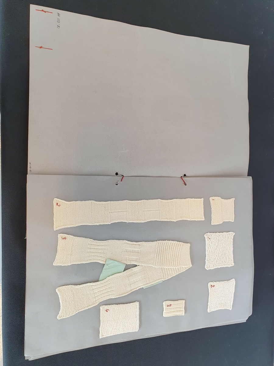 HH 110 - 81                                                                                                                            Børstadalle en 5         ARK 1
                                                                                                                                                Hamar
Elevarbeide samlet i mappe

Mappen er laget av grå kartong .
Arkene festet sammen med tvunnet , rød silkesnor .
Br.:    32 , 2
H.:    47 , 8
T.:   ca. 2,5
Prøvene sydd fast på kartongen.
Utv . festet visittkort "Aagot Beichmann ".

Første side :
7 strikkeprøver .
Hvite . Nummerert med rød tråd .
En: Ull hvit . Rett- og glattstrikning. "1" 6x6
To: Bomull. Rettstrikning . "1" 8x7
Tre: Bomull . Glattstrikning. " 2" 6 , 7x6 , 7
Fire : Ull . Rett- og glattstrikning. Glattstrikningen har en vrang stripe . "2" 6x30 , 7
Fem: Som fire , men seks ulike ribbestrikninger . " 3" 5x3,3
Seks: Ull. Ribbestrikning "3" 5x3
Syv : Bomull. Glattstrikning med fem pinner . " 4 " 7 , 7x6x5


Side to:
Strikkeprøve. Ull. Hvit. 13 mønstre.
Rette- og vrange masker "4" ca. 6x151

Side tre:
"Dukketeppe", hvitt.
Bomull. 4 forskjellige mønstre.
Rette- og vrange masker. "5" 23,5x31

Side fire·
7 prøver. Ull. Hvite.
En: Glattstrikning med en ribbe på midten. Skråfelling langs ribben .
    Br. oppe : 4, 5
    Br. nede: 11,3
    H: 11 
"5 "
To: Helfelling. Glattstrikket. "7" 10x10
Tre: Strømpe. Glattstrikket med vrangbord oppe.
   L. total: 3 3    "6"
    Vrangbord: 4,2
    Fot: 14
     Br. oppe: 7,5
Fire: Helfelling. Glattstrikket. "6" 5, 5x4
Fem: Tåfelling. Glattstrikking. "8"
Br. : 8, 2 H: 4
Seks: "Spissjal" Rettstrikking. Takkekant på to sider. "10"
H: 7 Br: 14 


Elevarbeide samlet i mappe
forts.
Syv: Tåfelling. Bomull. Glattstrikking. "6"  H: 9 Br: 6, 5

Side fem:
7 sømprøver. Lerret bomull. Hvite.
En: Fallesting med rød tråd. Attersting. 1"1" 3,5x13,7
To: Atter- og kastesting. "2" 14x6
Tre: Falle-, atter- og kastesting. 6 forskjellige faller. "3"  H: 14  Br: 19, 2
Fire: Falle-, atter og kastesting. 4 faller sydd på skrå. "4" 15x14,8
Fem: Knapphullsting. Et knapphull og et rundt hull kantet med knapphullsting. "6"   7,4 x5
Seks: Rynkeprøve. Linning på kortsidene. Falle- og attersting. "5" 15,5x12
Syv: Som "5"  En linning. "7".  Br: 7,5 L. Linning: 12
Br. linning: 2,5

Side 6: 5 sømprøver. Lerret bomull. Hvitt.
En: Attersting. Enkelt og dobbelt stolpe. "12" 6,8x19,6

To: Stolpe med rett avsluttning. Attersting. "13" 7,5x10
Tre: Skjorteåpning. Attersting. Dobbelt fold nedenfor stolpen. "14" 8,3x12,5
Fire: Stolpe med forsterkning. Attersting. "15" 7,2x9
Fem: 2 hullfalder, sammenkastning og attersting. "16" 10x12

Side seks:

Forkle. Bomull lerret. Hvitt. 10 perlemorsknapper.
Bomullsbånd med trådhempe i en ende. 3 bredder i forkle,
Kantet med skråband. Attersting. "19" H:18 br. nede: 17
Br. bånd:0,5 Br. oppe:7,8 L. bånd: 11
Side syv:
Bomull lerret, hvitt. 3 prøver. Attersting og foldesting.
Perlemorsknapper.
En: Vest. Stolpe med 3 knapper og knapphull. Knapphullsting.
Bånd i livet. "18". H. m.f.: 9,5 Br. største:13 H. m.b.:12 Br. hals: 4,5
To: Linnet. Løpegang med trekksnor i halsen. Kort erm. Sidesøm og ermsøm i ett. "19". H. m.f:15 Br. ermåpning:4,5 Br. nede:16,2
Tre: Skjorte. Lange ermer. Linning rundt hals og håndledd.
Forknappet med 4 knapper og knapphull. Knapphull og 6 knapper.
Knapphullsting. "20". Br. nede:26,2 H. m.f:21 H. m.b:23




Side åtte !

To sømprøver . Lerret bomull . Hvitt . Attersting , falle. og kastesting.
En : Underskjørt . 8 bredder . Utskrådd . Rynker i livet på bakstykke . Åpning midt bak med*knyttebånd på linningen. "21 ".
Br . oppe : 6 , 8 Br . nede : 2 0,7 H: 1 7 *Bornullsnor langs skjørtekanten .
To : Kyse. Kysen rynket til linning . I nakken løpegang med trekksnor . Atter- og faldesting . " 22 " L . linning : 21
L. knyttebånd : 11 , 2 Br . linning : 2 Br. knyttebånd : 2 , 5 Br . total : 8 , 5

Side ni:
sømprøve. Atter- falde- og knapphullsting . Bomull lerret . Hvitt . " 23" . Linnet med korte ermer. Rund hals med stolpe midt foran .
Lukking med perlemorsknapp og knapphull .
H. mf . : 25 , 4 H. m. b : 26 , 2 Br . nede : 24 Br . erm: 6 , 5
Side ti ;

4 sømprøver . Bomull lerret . Hvitt . Atter- falde og kastesting

En: Folder.  "8" 28x11
To: 4 skråfalder og en rett fald. "11" H:23,5 Br.11,5
Tre: Fald på midten med splitt i en ende og innfeldt firkant i den andre. "9" H:12 Br:10,3.
Firkant: 3,5x3,5
Fire: To sømmer med 4 forskjellige innfellinger som avslutning av sømmene. "10" 13,2x11,8
Side elleve:
Undebukse til kvinne. Bomull lerret. Hvit. Atter- og faldesting.
Linning oppe. To knyttebånd i hver side. H. m. f : 12, 5
L: total:24 H. m.b.:14,2 Br. ben nede:6 "  24".

Side tolv!
Nattskjorte. Lerret bomull. Hvit. Atter- falde- og kanpphullsting. Stående linning i halsen- Åpning midt foran med stolpe med 3 perlemorsknapper. Bærestykke ved skuldrene. Lange ermer med linning ved håndledd. Foldelagt ved ermhullet. Splitt i sidene.
"25" H. m.f:36,5 Br: nede: 28 Br. erm: 7,5 H. mb:37 Br. skulder:7,5

Side tretten!
5 sømprøver.
En: Bomull kypert. Hvit med sorte og røde striper. Røde knapphullsting langs kantene. "28" 11,5x11
To: Som en. Med røde kjedesting "C1" "31" 10x8,5
Tre: Hvitt , bomull lerret . To lapper satt på med atter - og faldesting . Kantet med røde knapphullsting. "26 ", "27" 15x10 , 4
Fire : Hvit bomull lerret . Med plattsøm "B" • "30" 10 , 8x8
Fem : Hvit stramei . Rødt bomullsgarn . Med korssting : "c ABCS . ABH" "(abhn . ) IMX " og 12 forskjellige border .
Kantet med knapphullsting. "29" 19 , 5x12, 3

Side fjorten :
2 sømprøver . Bomull sikteduk . Hvit . Rødbrun bomullstråd .
En : 4 forskjellige stoppemetoder . Knapphullsting langs
kantene. "32" 20 , 5x15, 5 .
To : Med holbeinsting ( kvalesøm ): "EKRP" og to border.
Med hullsting : "SLEKAH" og 5 forskjellige border .
Korsting : APLFD" og en bord . Knapphullsting langs kanten . "33" 20x12 .

Side femten :
5 strikkeprøver . Hvit ull .
En : Innstrikkete lapper i beige silketråd . Glattstrikking i to felt , ribbestrikking i et . Et glatt felt har skråfelling på midten . Rettstrikket kant langs hele prøvene .
"34" 20 , 3x7

To : Rettstrikket kant , ellers glatt strikk • Rød lapp. "35 "
5 , 6x6
Tre : Rettstrikket kant , eller glattstrikk , Ikke lapp . " RFL " i hvitt . 11 "36" B, 3x5 , 3 .
Fire : Rettstrikket kant , ellers glattstrikk . Innstrikket med huller "WX" og 5 border "37" . 15x8 , 5 .
Fem : Rettstrikket kant , ellers glattstrikk . Som 4 . " RL · 24"  og 5 border . "38" 14 , 5x8 , 5 .

Oppl. se HH 54-81 håndarbeidsprøve, strikking.


G. Agnes Beichmann                                                  4.11.81                                                                                          EIE

Oppl. giver:
Har tilhørt givers mann, politimester i Hamar, Reidar T. R. Beichmann, født i trondheim 1884, død i Hamar 1959. Tekstilene er utført av hans tanter Ragnhild og Aagot Beichmann.
Ragnhild var malerinne, f. 1854 og i 1874-77 utdannet hos Knut Bergslien i Christiania og 1877-79 hos Carl Gustav i Berlin. 
Hun malte hovedsakelig portretter. I sine senere år var hun meget syk. 
Aagot Beichmann har utdannelse som håndarbeidslærerinne ved Kvindelig Industriskole i Christiania 1892. Fru Agnes Beichmann bodde i Børstadalleén 5, Hamar etter at hun ble enke.
Flyttet i nov. 1981 til Østregate 122.