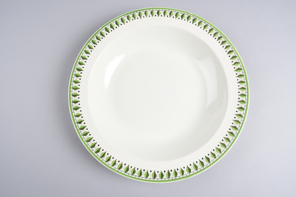 Stilisert borddekor i to grønnfarger langs kanten.