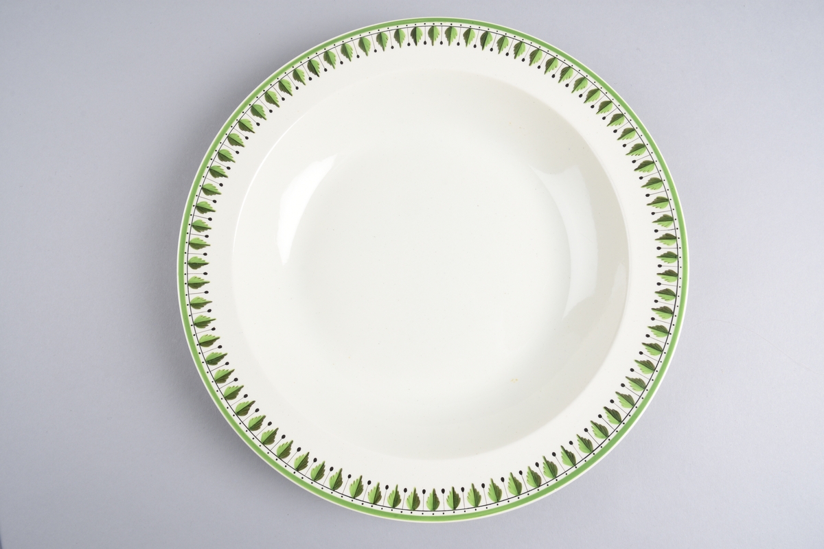 Stilisert borddekor i to grønnfarger langs kanten.