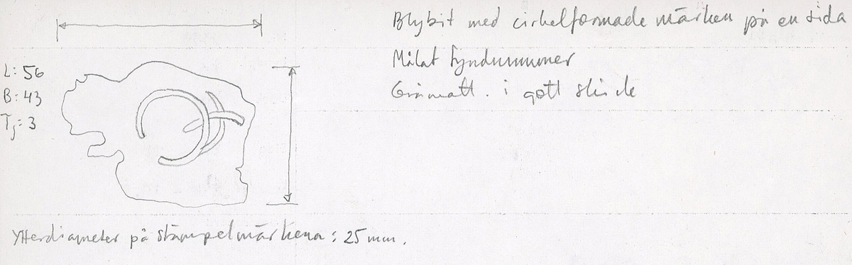 Blybit med tre cirkelformade märken på en sida. Gråmatt.