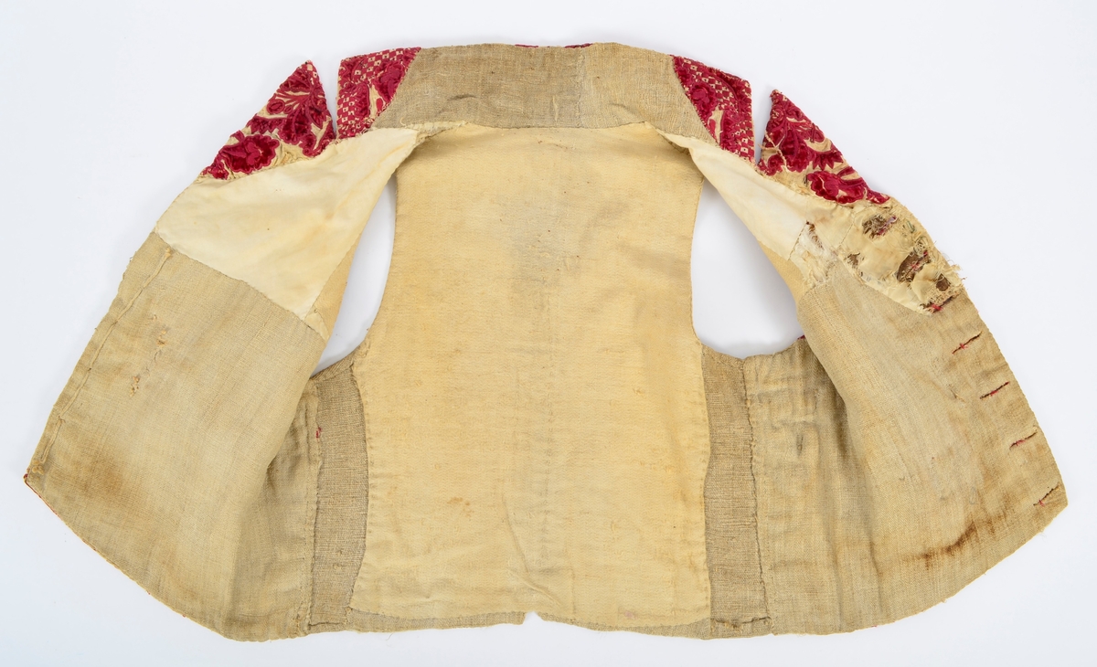 Vest med brodert mønster, applikasjoner av plysj.