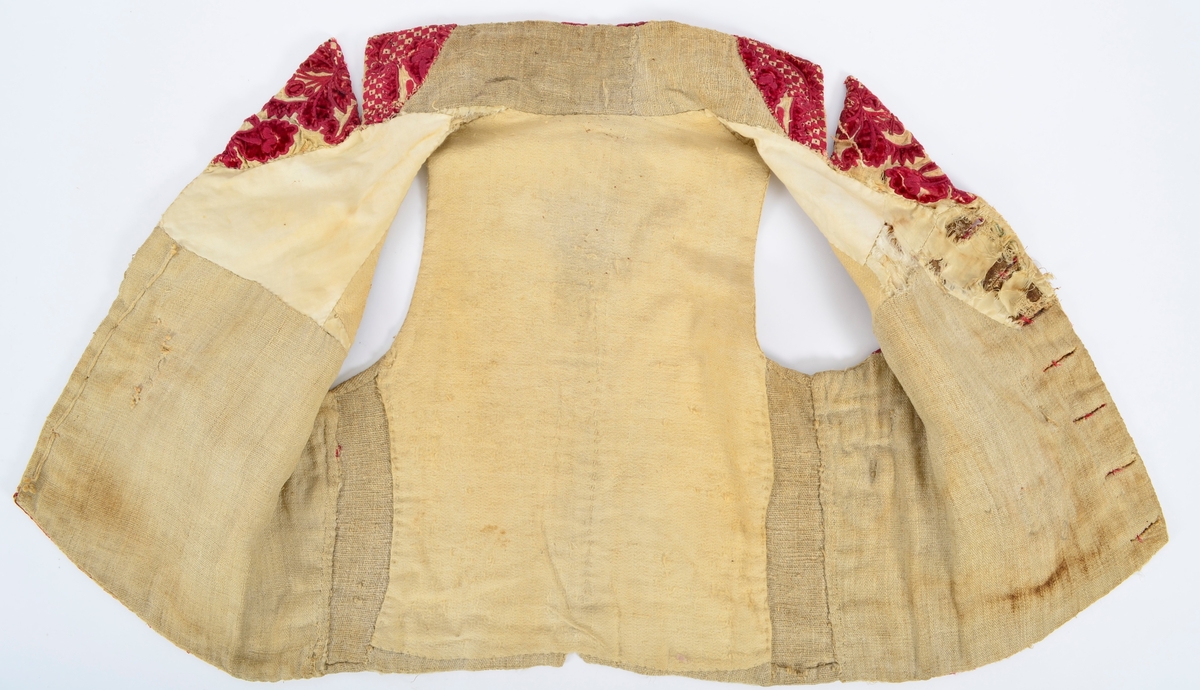 Vest med brodert mønster, applikasjoner av plysj.