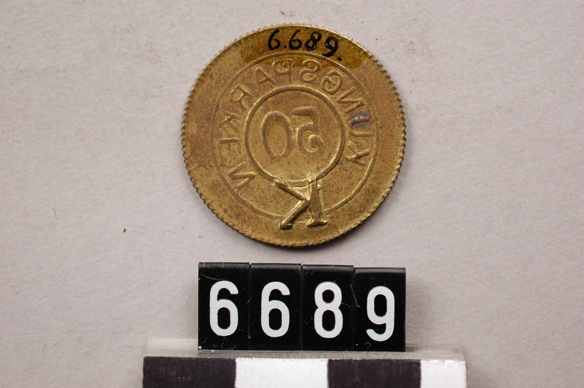 Pollett av mässing.