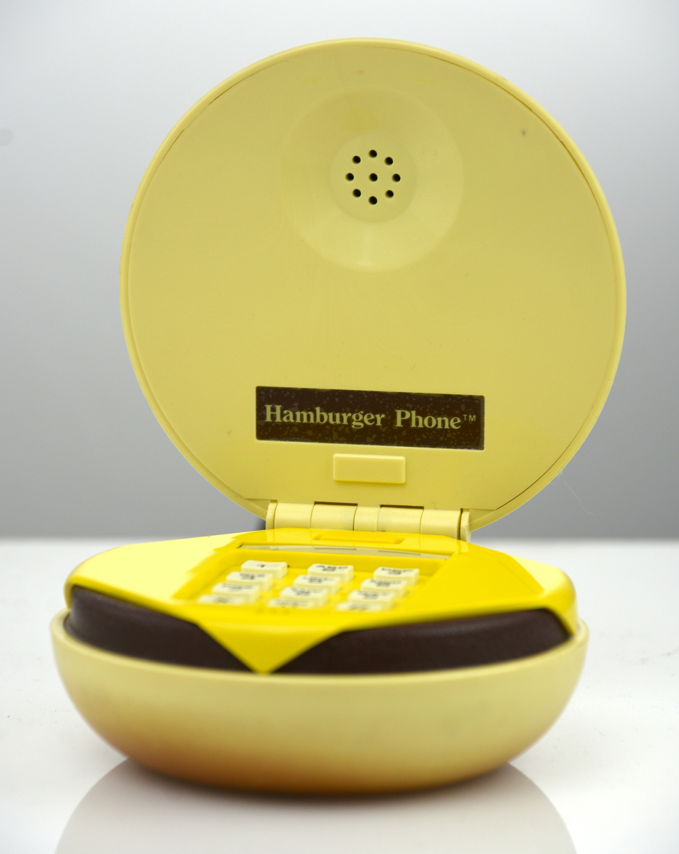 Telefonapparat med pulsval, i originalkartong,i form av en hamburgare.