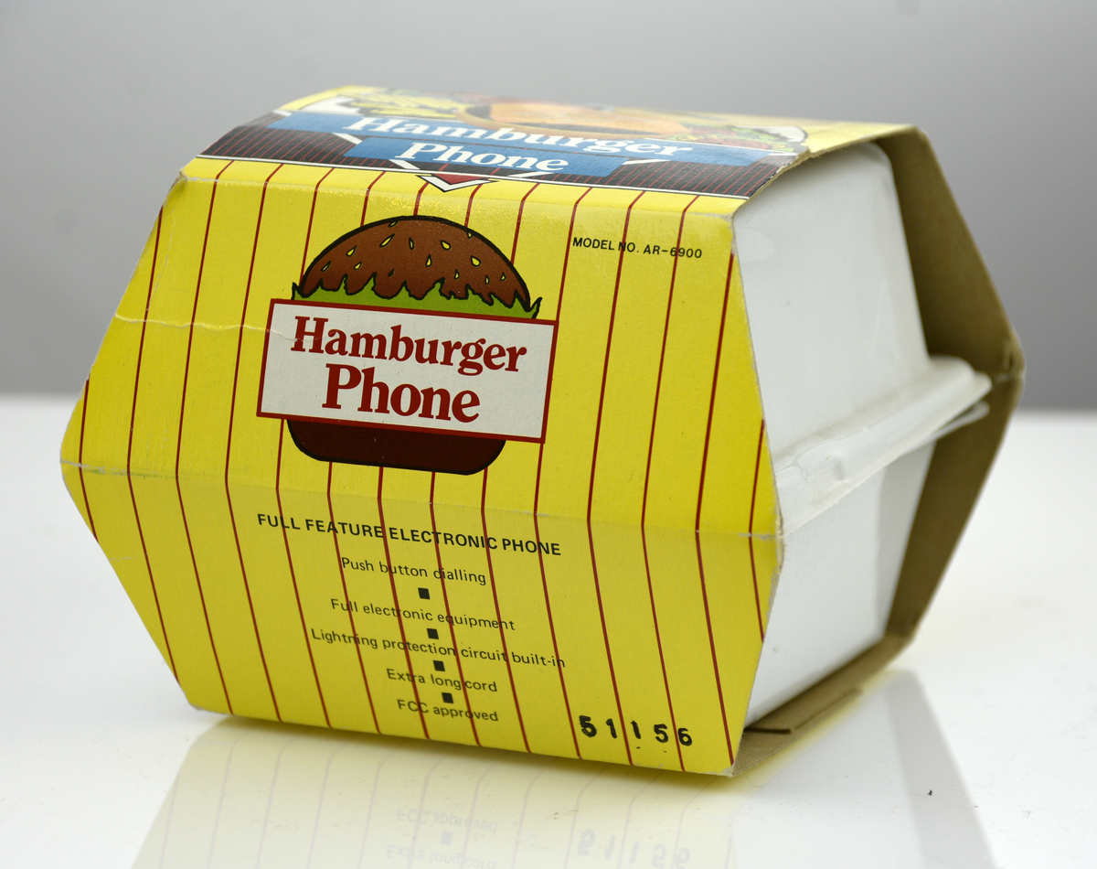 Telefonapparat med pulsval, i originalkartong,i form av en hamburgare.