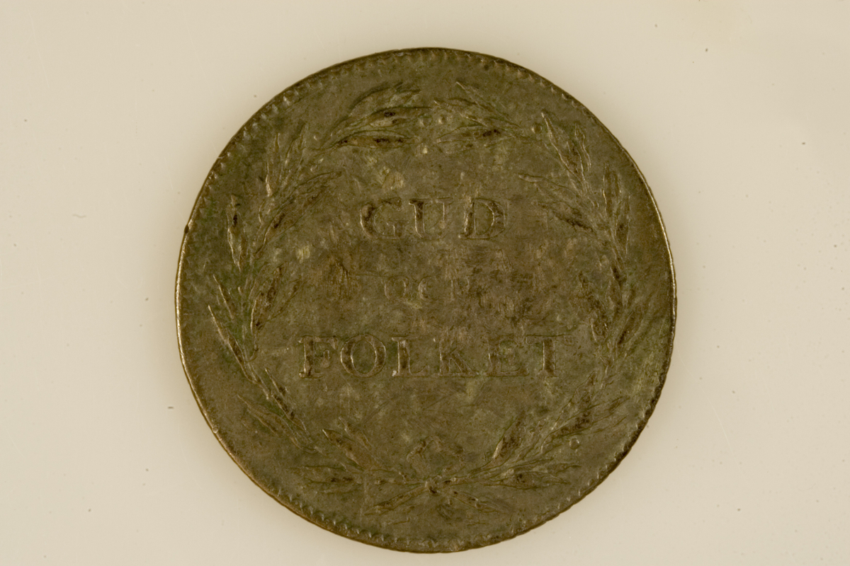 Motiv advers: Kong Gustav IV Adolf av Sverige i kroningsdrakt med de svenske ordenkjedene, kronet byste i profil mot høyre.

Motiv revers: Laurbærkrans om tekst.