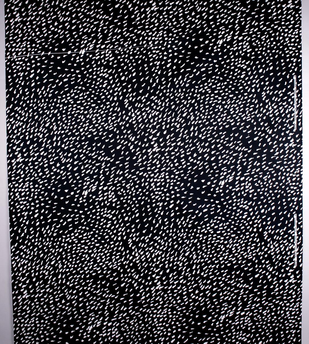 Svart botten med ojämna vita fläckar strödda över tyget. (Provtryck)