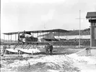 Flygplan Thulin G märkt nr 14 står vid en flygstation, omkring 1918-1919.