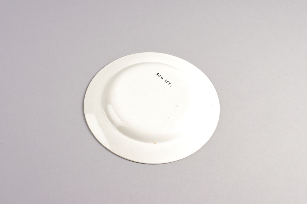 Stilisert borddekor i to grønnfarger langs kanten.