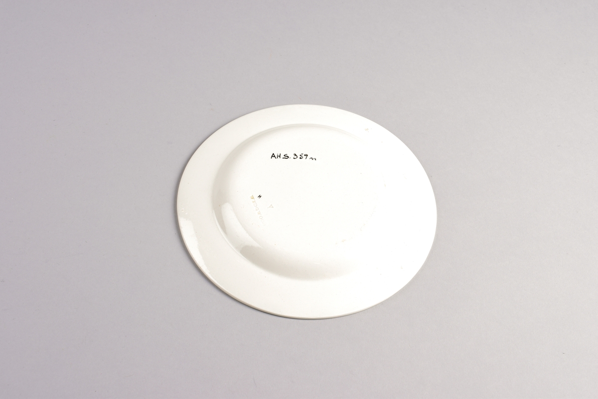 Stilisert borddekor i to grønnfarger langs kanten.