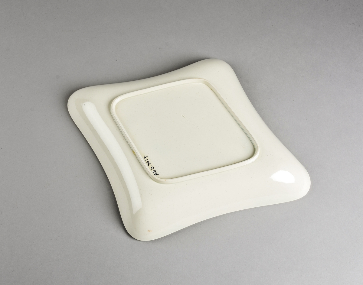 Stilisert borddekor i to grønnfarger langs kanten.