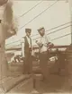 Fotografi från första svenska Antarktisexpeditionen 1901-1904. Motiv av två män ombord på fartyg.