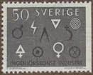 Frimärke ur Gösta Bodmans filatelistiska motivsamling, påbörjad 1950. Frimärke från Sverige, 1963. Motiv av Triangel och andra 3000-år gamla symboler för svensk industri och ingeniörkonst. Triangeln med spetsen nedåt representerar vattenkraften.