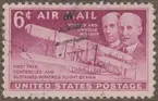 Frimärke ur Gösta Bodmans filatelistiska motivsamling, påbörjad 1950.
Frimärke från USA, 1949. Motiv av Det första motordrivna biplanet. Första flygningen den 3 dec. 1903. 260 meter på 56 sek. Till minne av bröderna Wilbur Wright: 1867-1912 och Orville Wright: 1871-1948