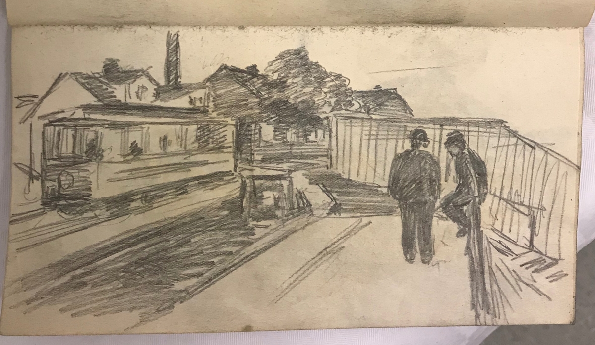 Brun skissebok med svart rygg [Tegning]