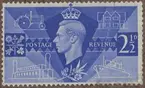 Frimärke ur Gösta Bodmans filatelistiska motivsamling, påbörjad 1950.
Frimärke från England, 1946. Motiv av Oceanbåt och symboler för handel och industri. -Kung George VI.- -Minne av återuppbyggnaden efter världskrig II.-