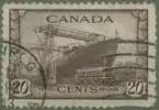 Frimärke ur Gösta Bodmans filatelistiska motivsamling, påbörjad 1950.
Frimärke från Canada, 1943. Motiv av Stapelavlöpning av canadensiskt fartyg av s.k. 