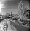 Vinterlandskap. Vy mot Bunnström, Solliden. Fotot taget mot väster utmed landsvägen. Huset till höger är numera rivet.