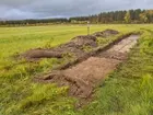 Vy över utredningsområde och schakt från arkeologisk utredning i Säversta, Bollnäs sn, Bollnäs kn. Foto mot västsydväst.