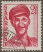 Frimärke ur Gösta Bodmans filatelistiska motivsamling, påbörjad 1950.
Frimärke från Saar, 1948. Motiv av Järnarbetare i Saar