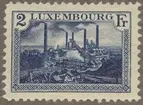 Frimärke ur Gösta Bodmans filatelistiska motivsamling, påbörjad 1950.
Frimärke från Luxemburg, 1921. Motiv av Masugnar vid Esch i Luxemburg 1921.
