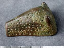 Djurhuvudformade spännen