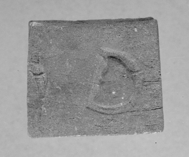 Avtryck av järnstämpel i prov av stångjärn. 