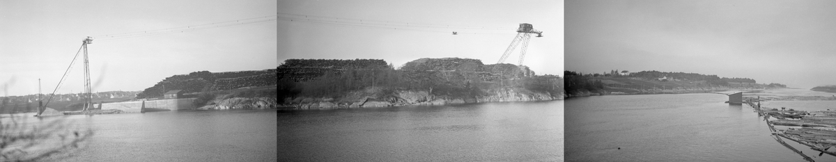 Digre tømmerlunner på Borregaard fabrikkers tømmerterminal ved Oppsund (i noen sammenghenger også stavet Opsund) i Sarpsborg. på vestre elvebredd, like nord for Østfoldbanens trasé. Dette er et tredelt panoramaopptak, sammensatt av kopier sdom er limt inntil hverandre. De to bildene til venstre viser terminalområdet, med høye stålkraner i ytterendene. Disse kranene ble brukt til å løfte tømmer opp fra elva og inn på terminalplassen der virket ble samlet i enorme lunner i påvente av at det kunne traqnsporteres videre inn i fabrikken. Bildet til høyre viser en del av et lenseanlegg som samlet opp tømmer som kom fra den ovenforliggende delen av elveløpet.