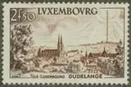 Frimärke ur Gösta Bodmans filatelistiska motivsamling, påbörjad 1950.
Frimärke från Liechtenstein, 1955. Motiv av Stadsbild av Dudelange: Dom. TV-station (i horisonten) -Minne av installationen av Dudelange TV-station: 1955-