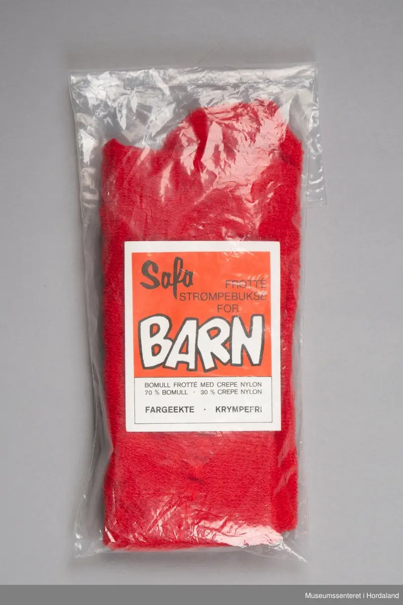 Raud Safa barnestrømpebukse for barn i frottéstoff, pakka i plastemballasje og produktinformasjon.