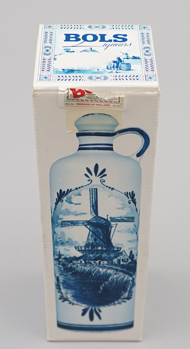 Kvit flaske med nederlandsk blå dekormåling. Pappkartong med nederlkandske folkelege motiv.