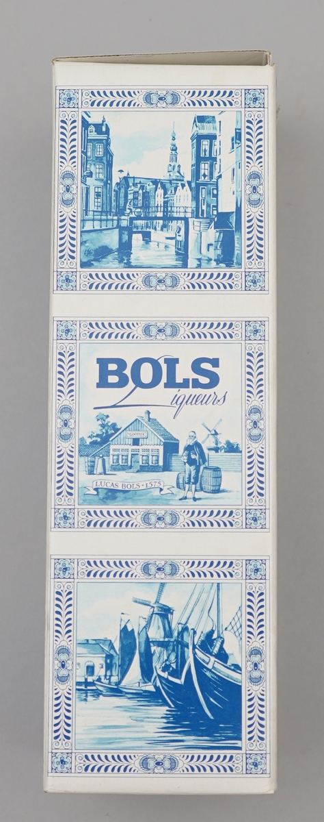 Kvit flaske med nederlandsk blå dekormåling. Pappkartong med nederlkandske folkelege motiv.