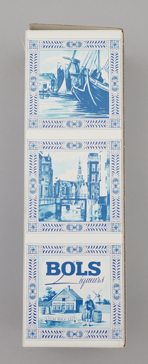 Kvit flaske med nederlandsk blå dekormåling. Pappkartong med nederlkandske folkelege motiv.