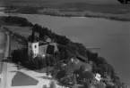 Flygfoto över Svärdsjö kyrka 1935-1937. Läs mer om Svärdsjö kyrka i boken: Dalarnas kyrkor i ord och bild.