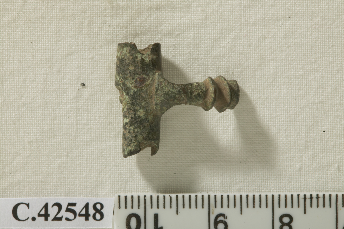 Fragment. Upper part of the bow and the hinge of a fibula, probably of Late La-Tène type.